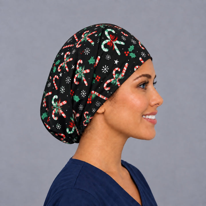 Christmas candy cane Euro surgical hat, right angled smiling view — handmade black holiday cap, USA made
