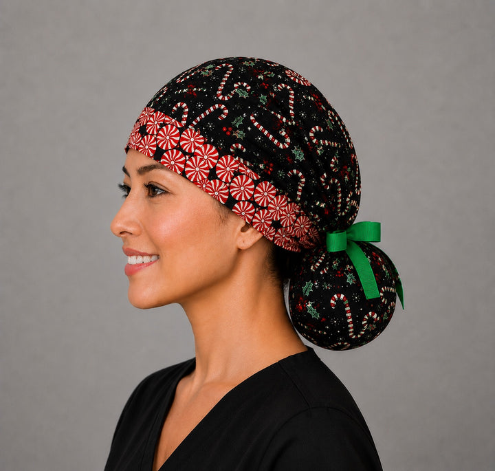 Christmas candy cane peppermint ponytail scrub cap left side profile with full ponytail pouch of candy canes and holly and long green ribbon ties