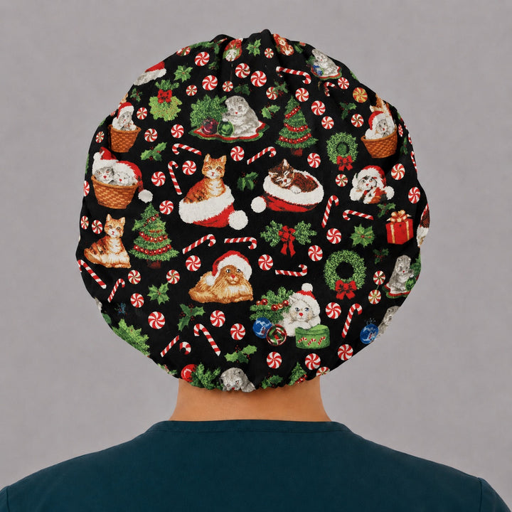 Back view of the Christmas cat bouffant scrub cap — full gathered coverage showing Santa kittens, wreaths and peppermints on black