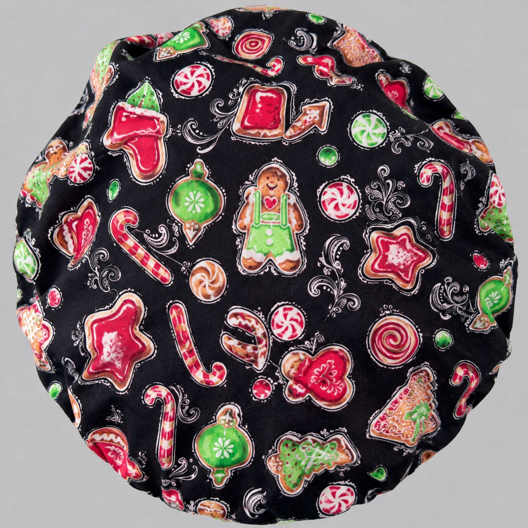 Christmas gingerbread man bouffant surgical cap left side profile showing gingerbread men and candy canes on black, OR World holiday nurse hat