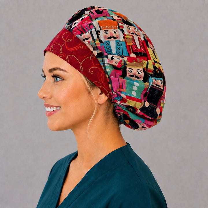 Left side profile of the Christmas nutcracker bouffant surgical hat — jewel-toned soldier print with crimson band, roomy breathable cotton cap