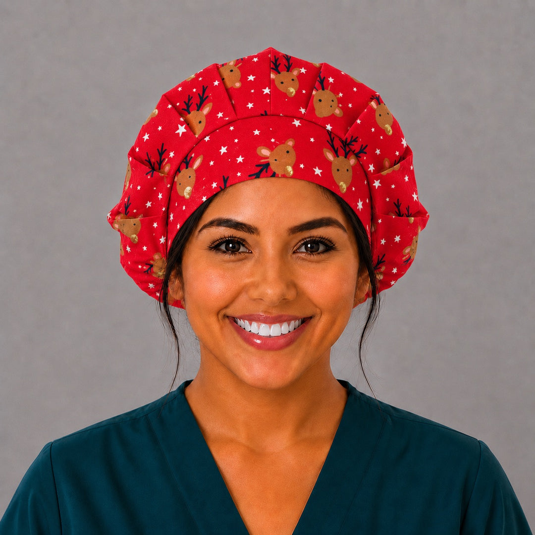 Woman wearing a Christmas reindeer bouffant scrub cap, front view — cute reindeer and white stars on cherry red, adjustable women&
