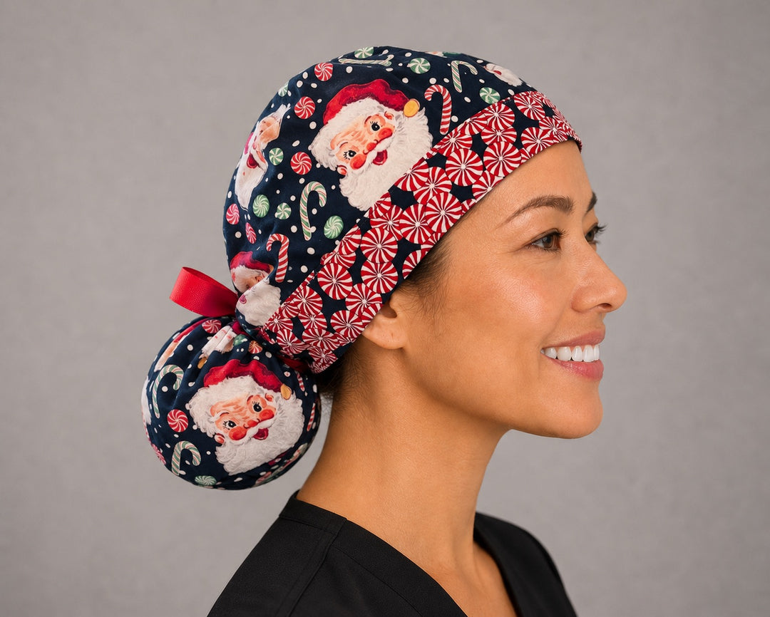 Christmas Santa ponytail scrub cap left side profile showing gathered ponytail pouch of vintage Santa faces and candy canes on navy with peppermint band and red ribbon tie