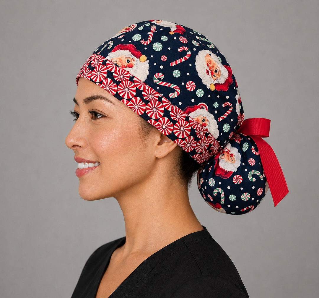 Christmas Santa ponytail scrub cap right side profile with full ponytail pouch of vintage Santa faces and peppermints on navy and long red ribbon ties