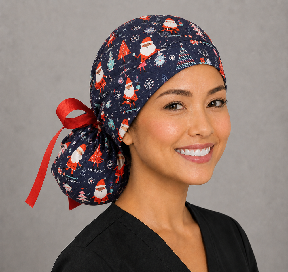 Christmas Santa ponytail surgical cap right three-quarter angle on smiling model showing Santas, Christmas trees and snowflakes on navy blue with red ribbon bow