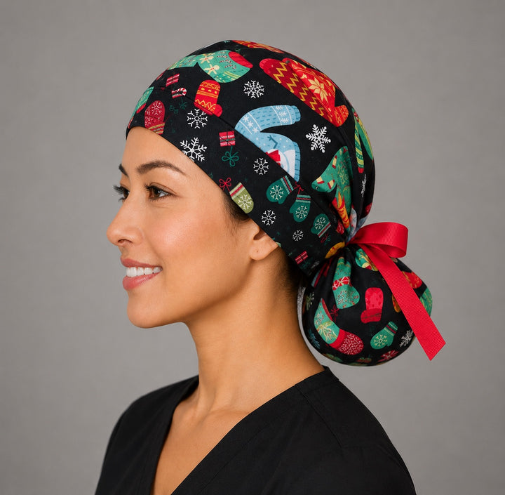 Christmas ugly sweater ponytail nurse cap left three-quarter angle on smiling model showing knit sweaters, mittens and snowflakes on black with red ribbon bow