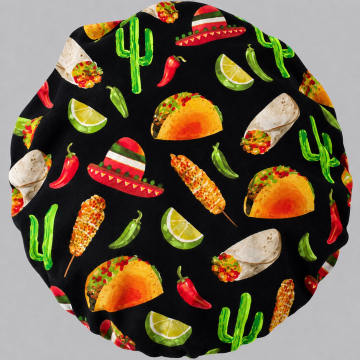 Cinco de Mayo fiesta bouffant scrub cap fabric close-up showing tacos, chili peppers, sombreros, corn, limes and cactus on black, OR World Mexican food surgical hat