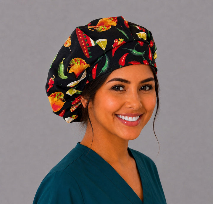 Cinco de Mayo fiesta bouffant scrub cap right three-quarter angle on smiling model showing tacos, chili peppers and Mexican food on black, OR World nurse hat