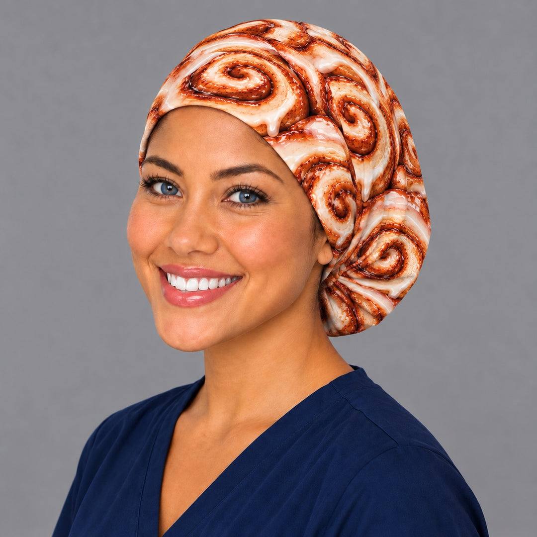 Nurse wearing a funny cinnamon roll euro scrub cap covered in iced cinnamon buns, an OR World original food print surgical cap handmade in the USA
