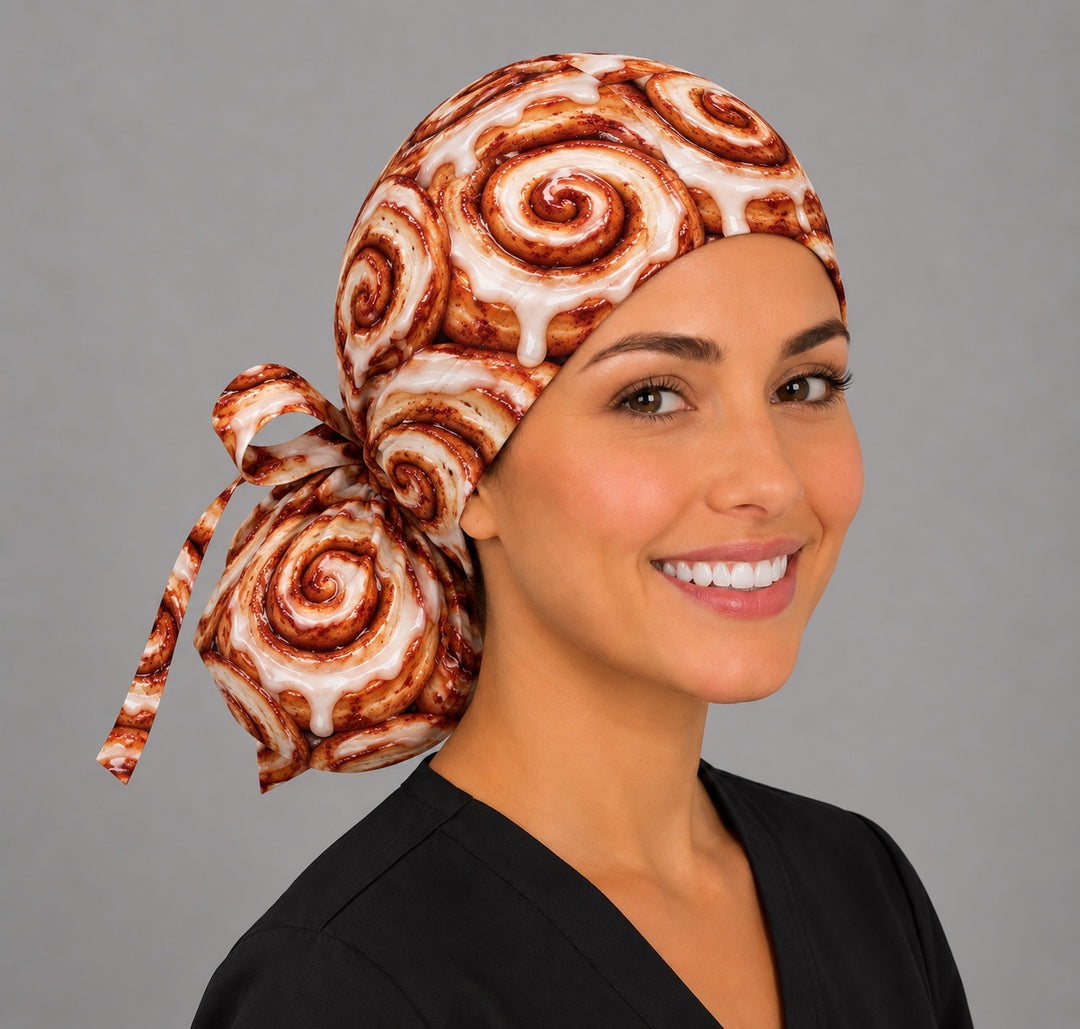 Side view of a cinnamon roll ponytail cap with matching ribbon bow, a sweet scrub cap for scrub techs and CRNAs