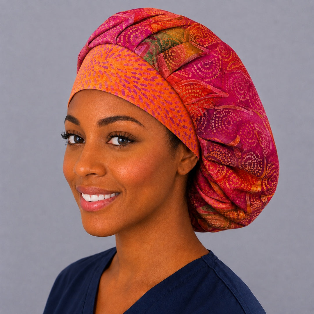 Citrus berry batik bouffant cap for women, left angled smiling view — handmade summer surgical cap, USA made