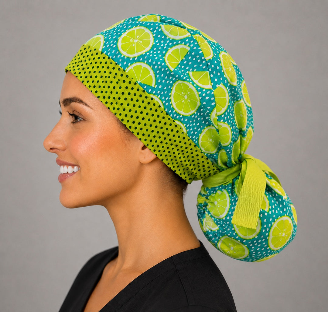 Citrus lemon lime ponytail surgical cap left side profile showing gathered ponytail pouch of lime slices on teal and lime green ribbon tie
