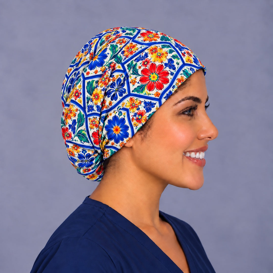 Right profile of a cobalt tile print Euro surgical hat for women, showing the soft pleats gathering at the back and full coverage to the nape