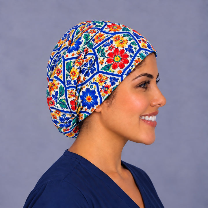 Right profile of a cobalt tile print Euro surgical hat for women, showing the soft pleats gathering at the back and full coverage to the nape