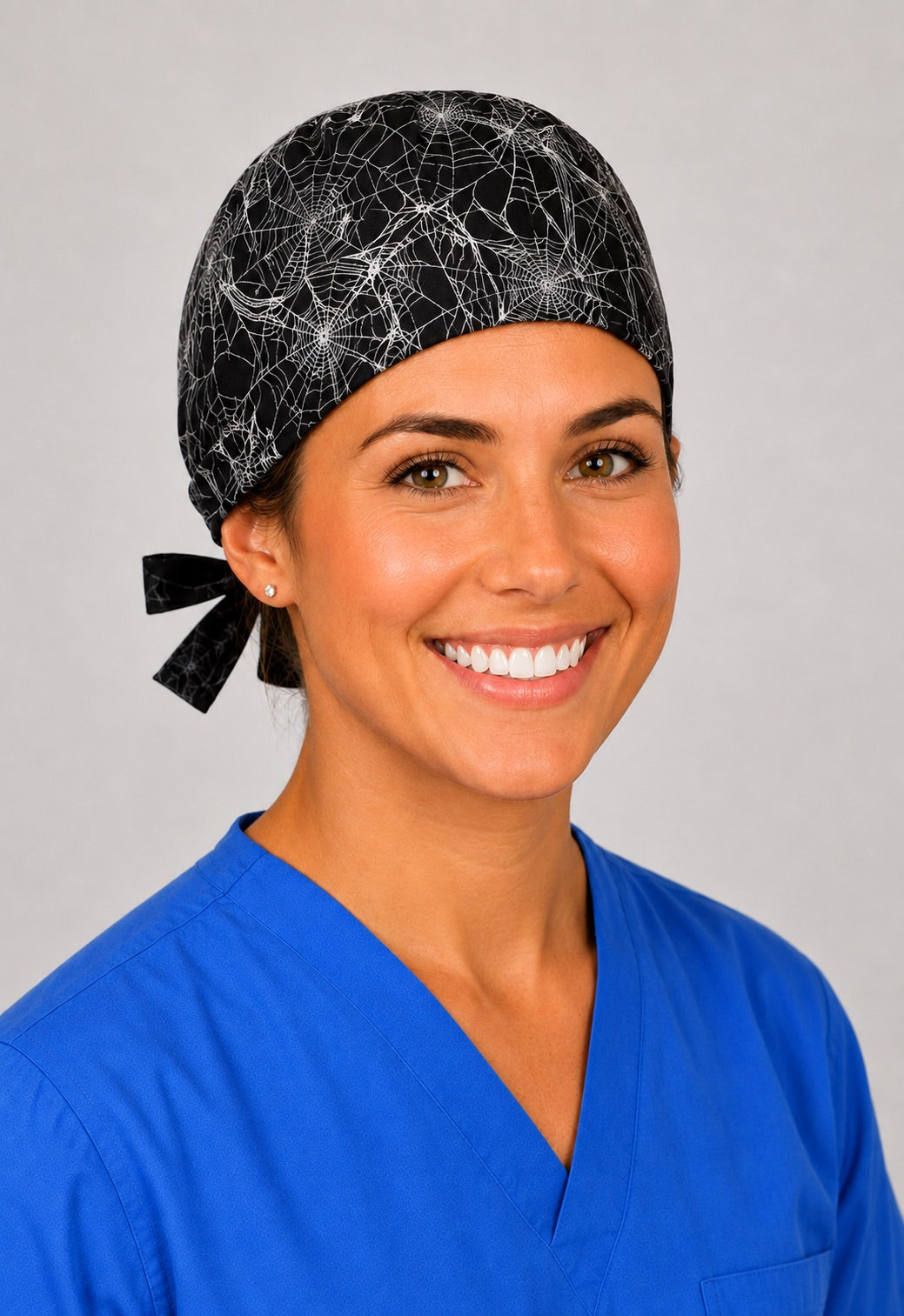 Left profile of cobweb scrub cap for women with short hair, gothic Halloween OR cap in black
