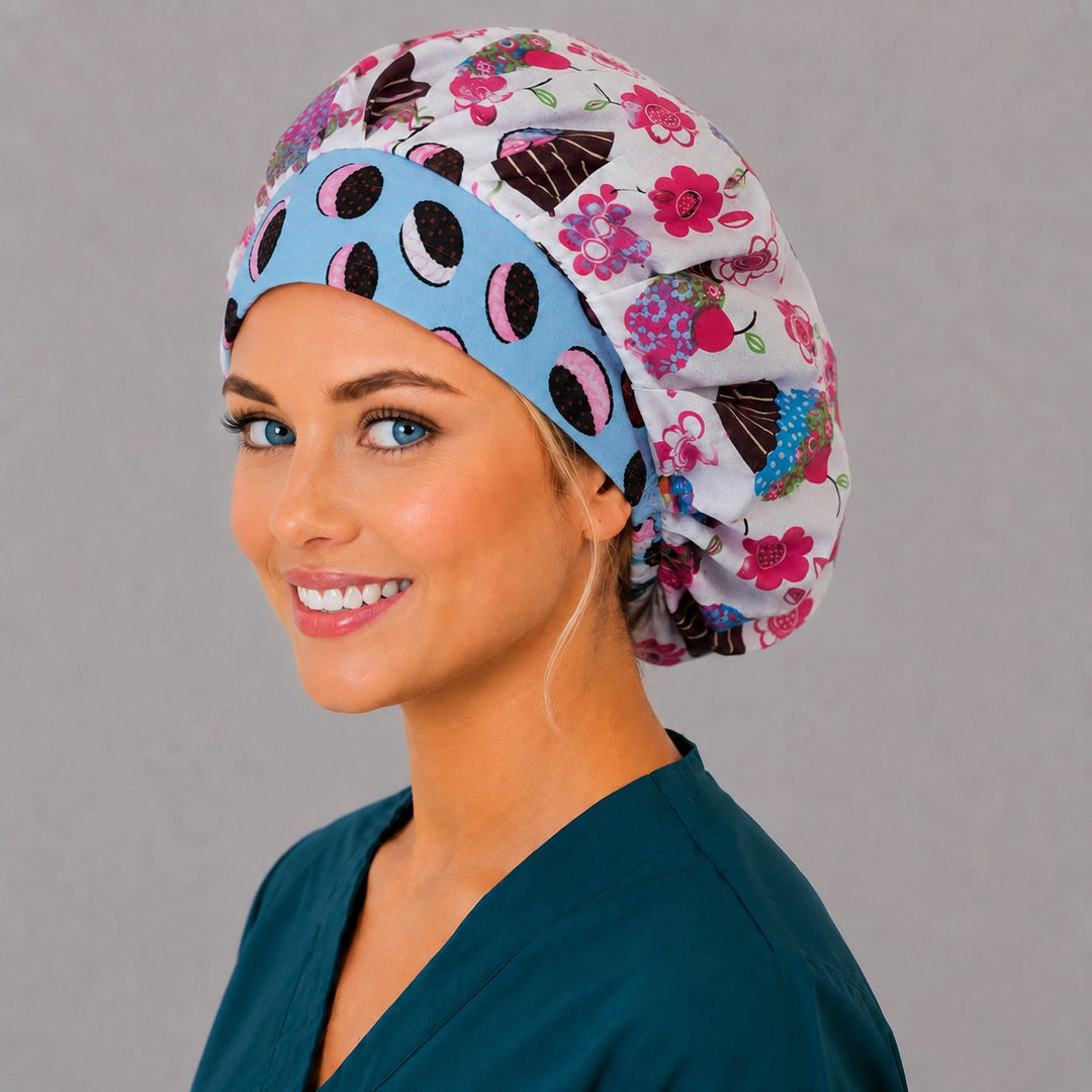 Colorful bakery cupcake bouffant scrub cap angled smiling view — roomy dessert print cap that secures long thick hair