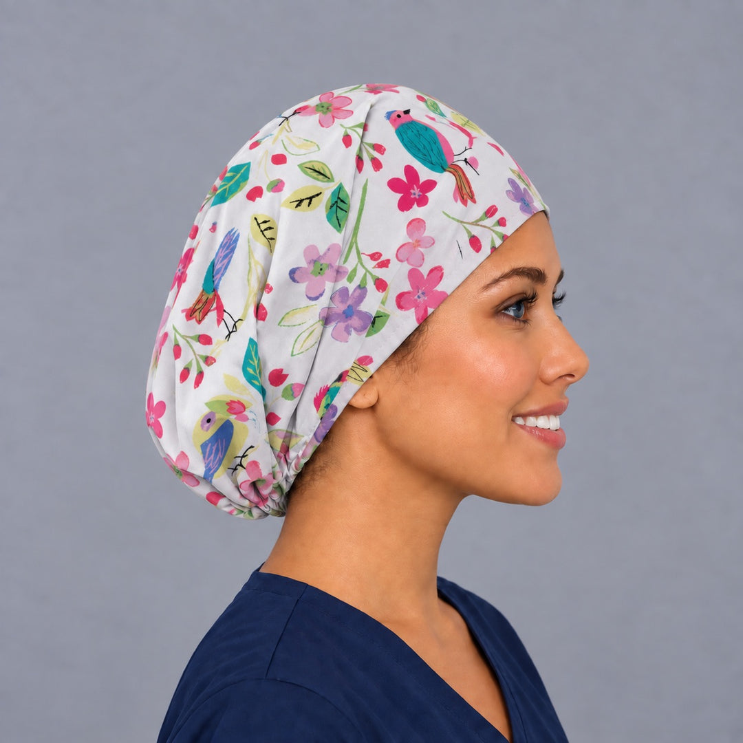 Right side profile of the colorful bird Euro surgical hat — teal and coral songbird floral print, breathable cotton cap for nurses