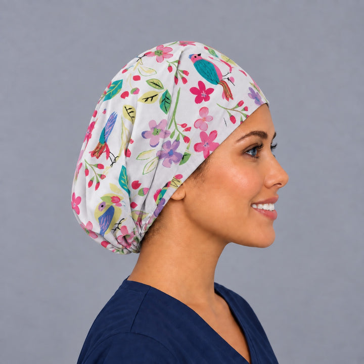 Right side profile of the colorful bird Euro surgical hat — teal and coral songbird floral print, breathable cotton cap for nurses