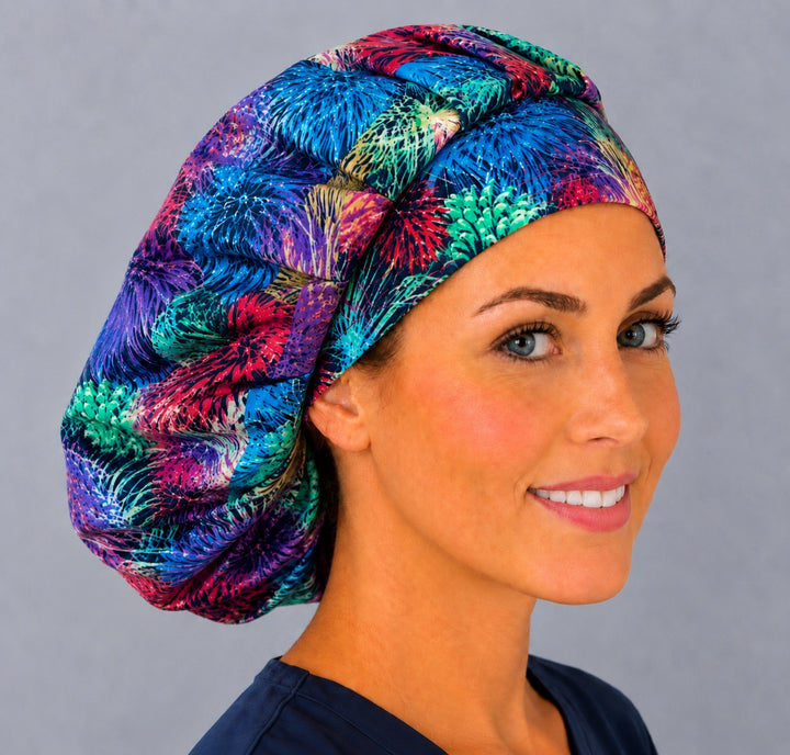 Colorful celebration bouffant surgical cap for long hair, left angled view — deep gathered fit that secures thick or braided hair