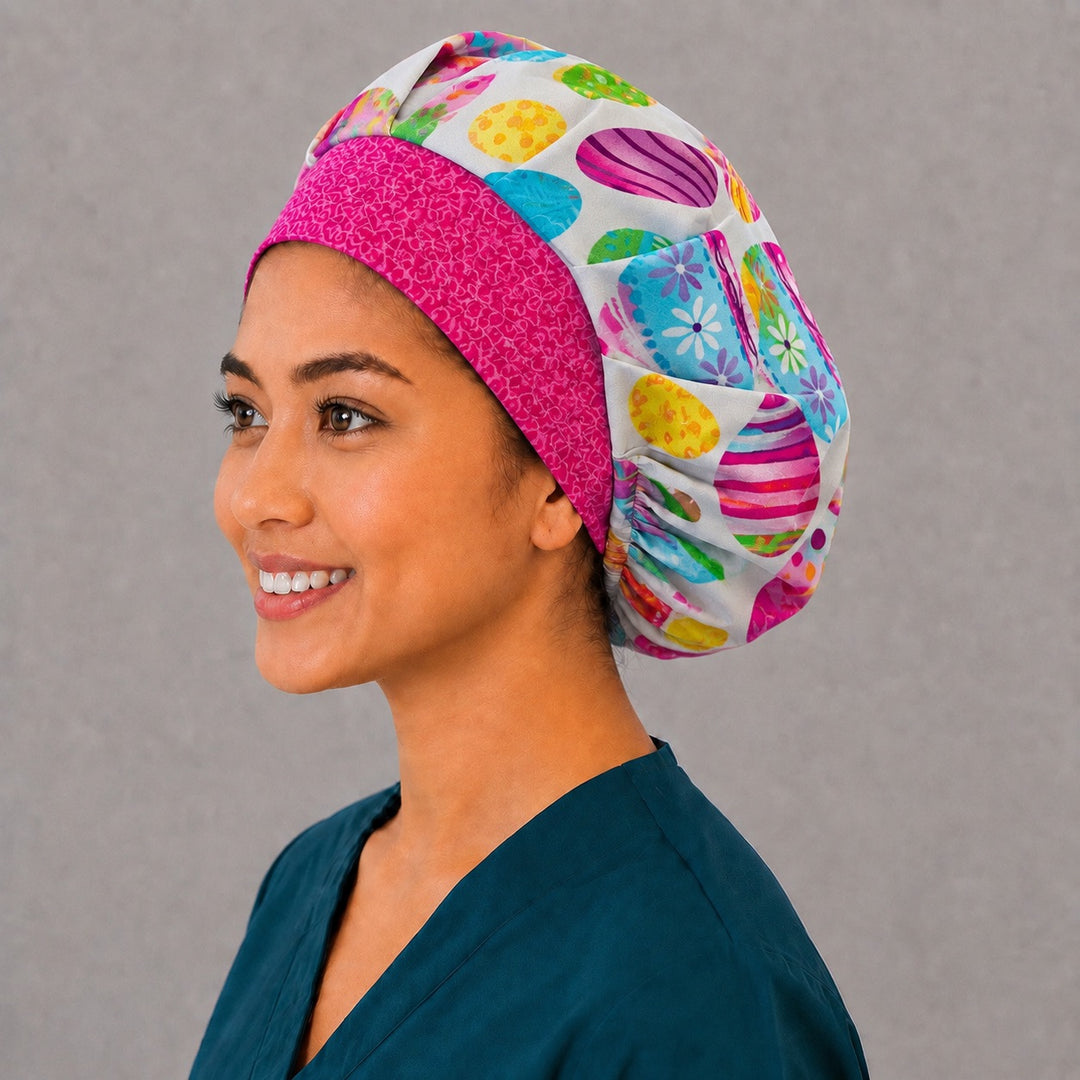 Left side profile of the colorful Easter egg bouffant surgical hat — hot-pink contrast band, roomy breathable cotton cap for nurses