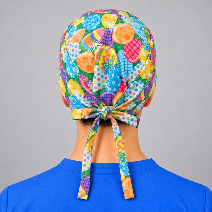 Colorful Easter egg surgical hat in straight front view, unisex spring cap sized for short hair