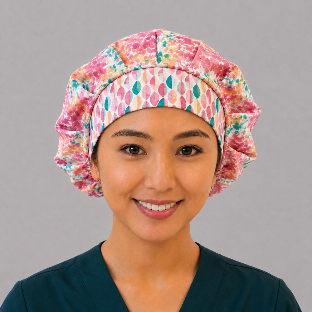 Colorful floral watercolor bouffant scrub cap for women, front view, bright pink teal and orange watercolor florals with geometric band, handmade surgical hat by OR World