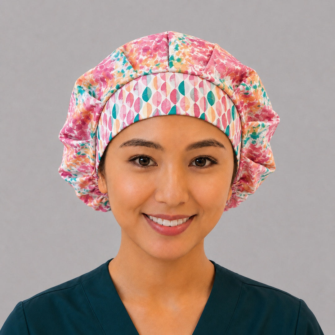 Colorful floral watercolor bouffant scrub cap for women, front view, bright pink teal and orange watercolor florals with geometric band, handmade surgical hat by OR World