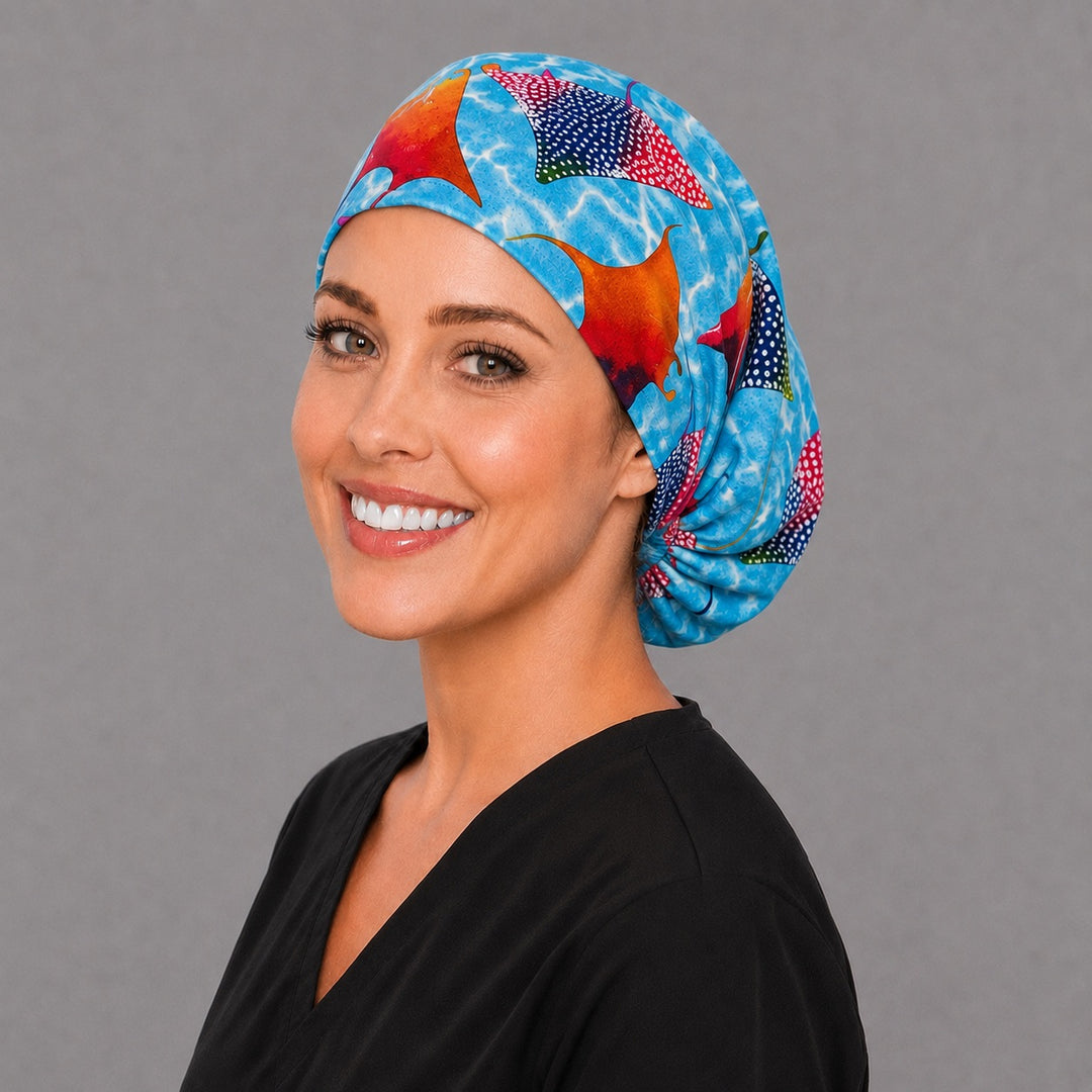 Colorful manta ray Euro cap, right angled smiling view — handmade marine life surgical cap, USA made