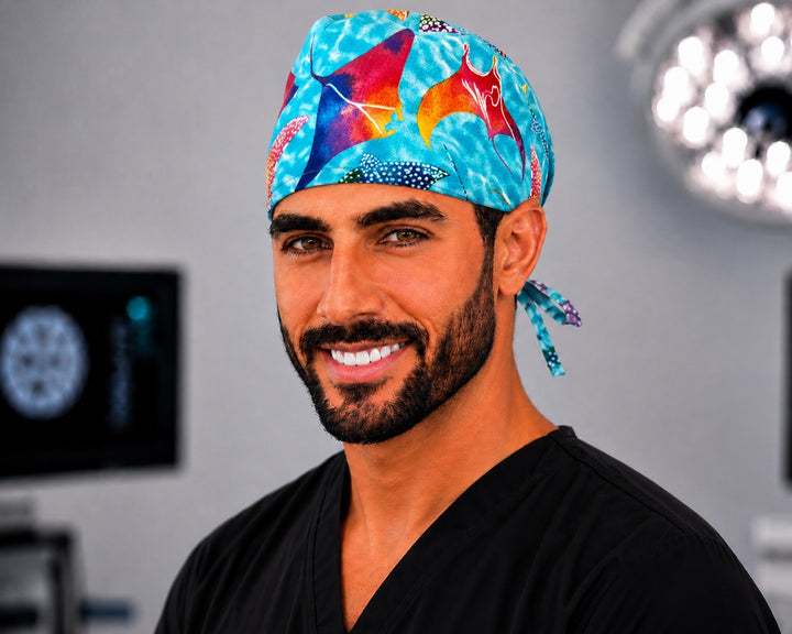 Male nurse wearing OR World colorful manta ray tieback scrub cap for men, ocean sea life surgical hat, front view