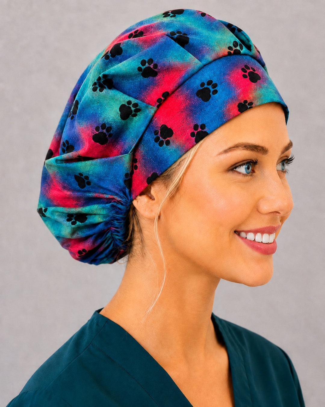 Colorful paw bouffant cap for women, right side profile — handmade veterinary surgical cap, USA made