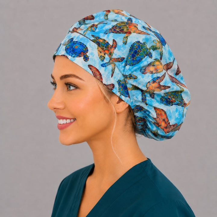 Colorful sea turtle Hawaiian bouffant scrub cap front view on smiling model, tropical ocean turtles print, women&