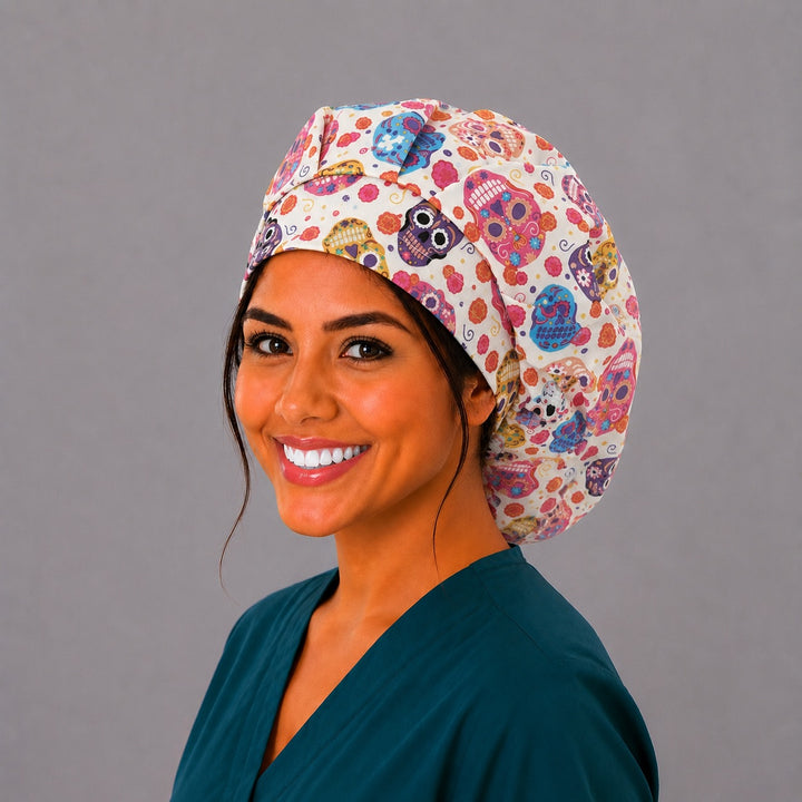 Colorful sugar skull bouffant scrub cap right side profile showing bright Day of the Dead skulls and marigolds on cream, OR World Mexico collection surgical hat
