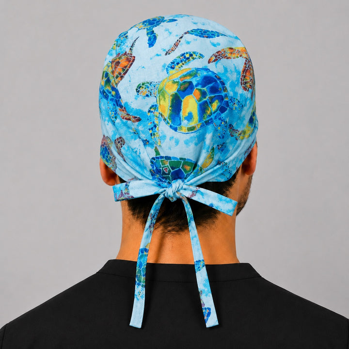 Back view of adjustable tie-back knot on colorful watercolor turtle scrub cap surgical hat for men