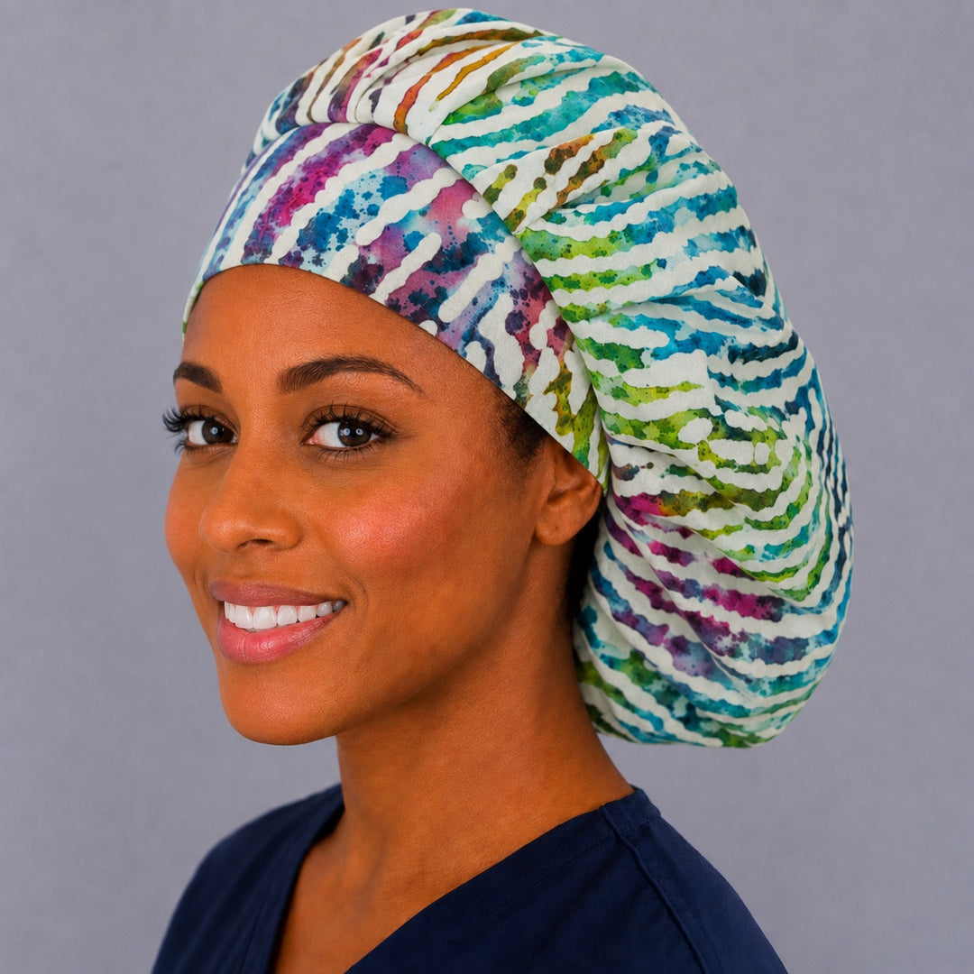 Colorful zebra bouffant surgical cap for long hair, left angled view — deep gathered fit that secures thick or voluminous hair