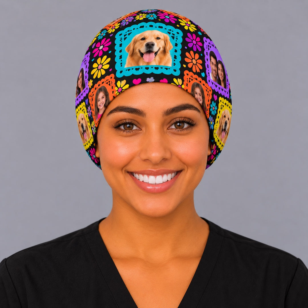 Front view of a custom family photo Mexican scrub cap with colorful papel picado borders and flowers