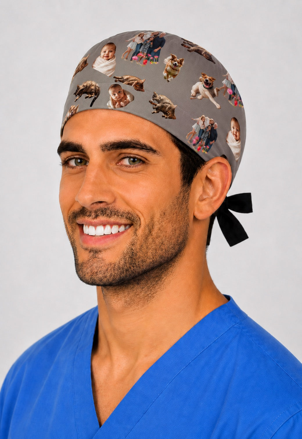 Custom photo cutout collage scrub cap for men on a solid charcoal background, front three quarter view on a male surgeon in blue scrubs, personalized cut out family and pet photos scattered across a tie back surgical hat, premium custom photo printing gift for surgeons and OR teams, handmade in USA, OR World