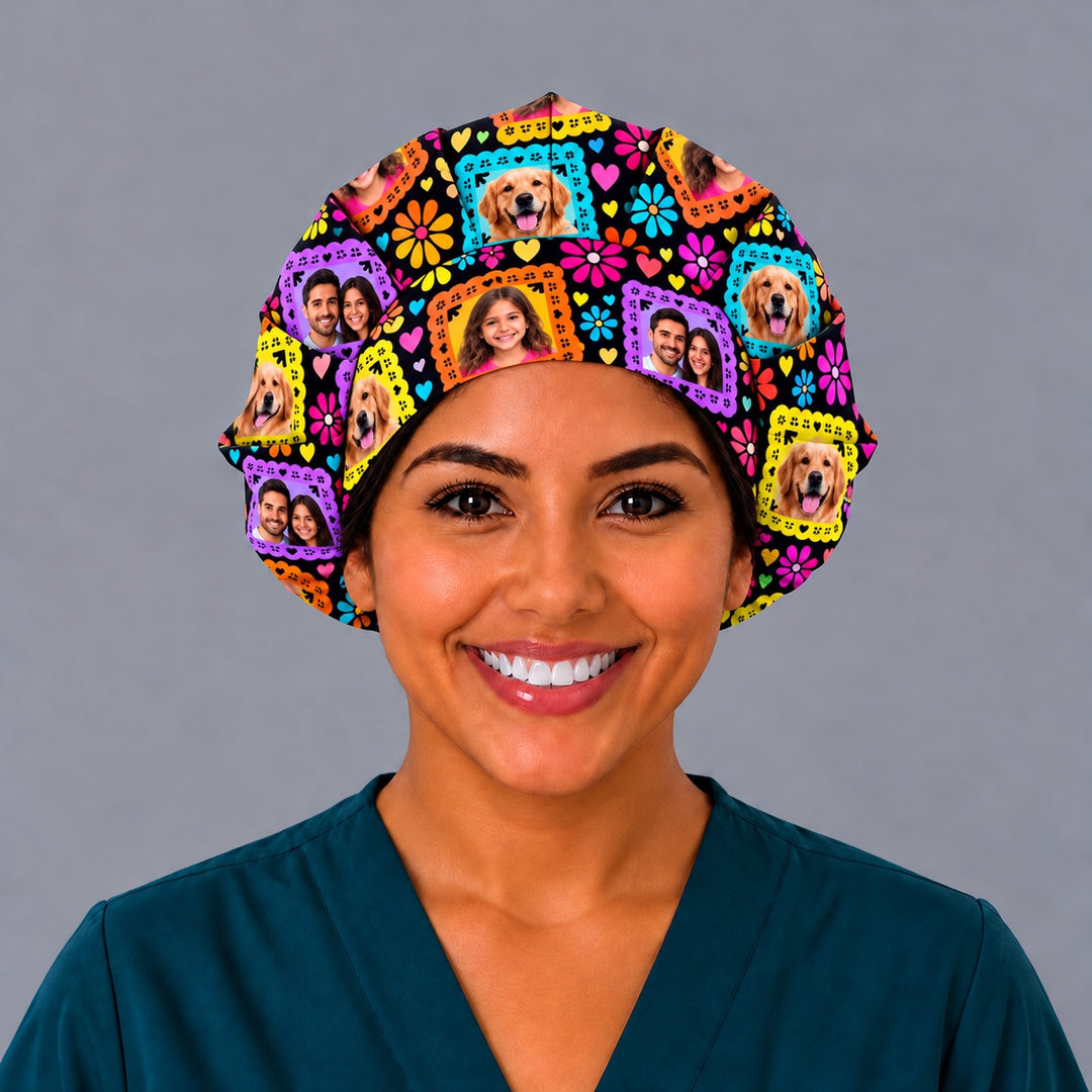 Smiling nurse in teal scrubs wearing a custom photo papel picado bouffant scrub cap, front view with family, child and golden retriever photo frames across the band