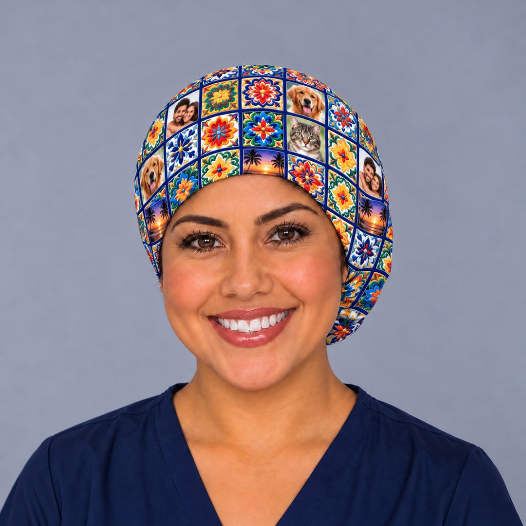 Smiling nurse in navy scrubs wearing a custom photo Talavera tile euro scrub cap, front view with dog, cat, couple and sunset photo tiles set among cobalt floral tiles