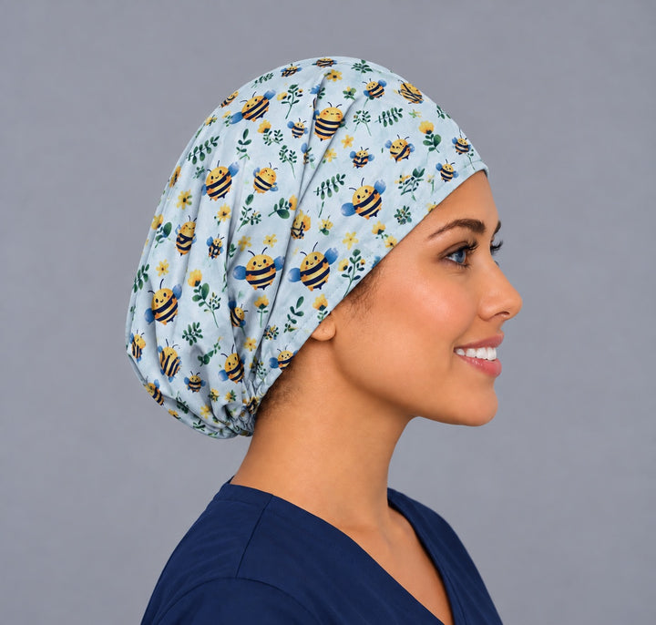 Right side profile of a cute bee surgical cap for women, showing the adjustable elastic gather sitting low at the nape behind the ear