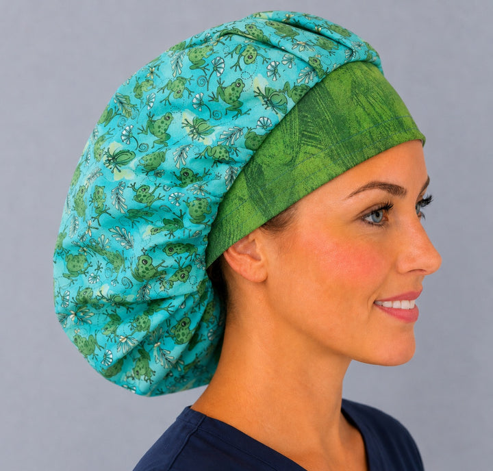 Side view of the cute frog bouffant cap for women on a smiling vet tech — handmade green frog print cotton surgical cap, USA made