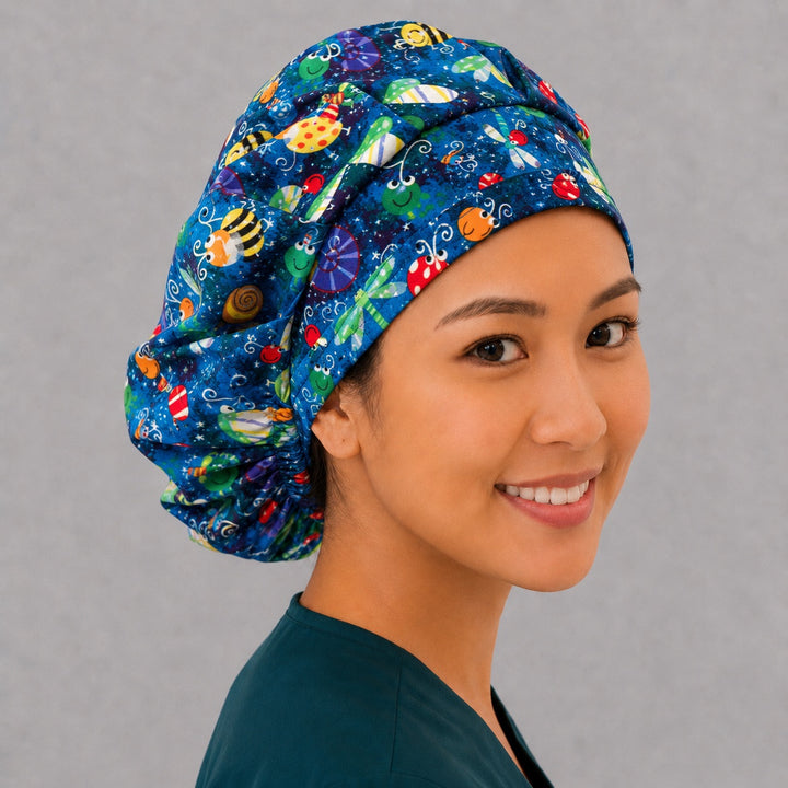 Cute insect bouffant surgical cap, three-quarter view — roomy blue bug print bouffant scrub hat for vet techs and OR staff, breathable cotton