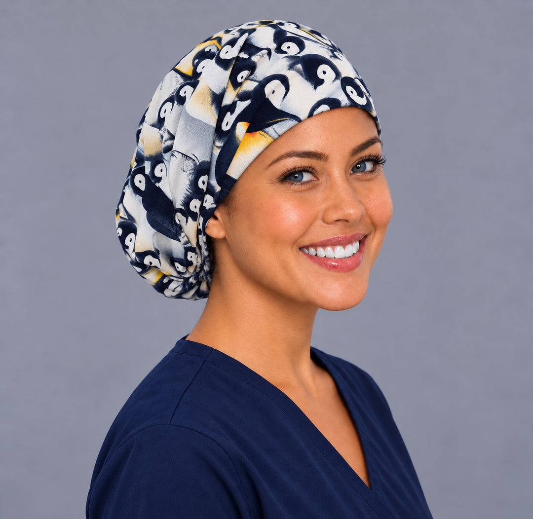 Cute penguin Euro scrub cap, right angled smiling view — winter animal print for surgical techs and vet teams