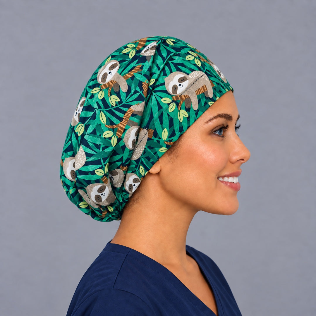 Right side profile of the cute sloth Euro surgical hat — emerald and lime jungle leaf print, breathable cotton cap