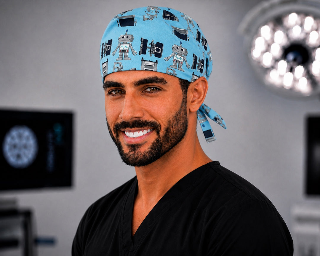 Male surgical tech wearing OR World Da Vinci robot print tieback scrub cap, teal robotic surgery cap for men, front view in the operating room