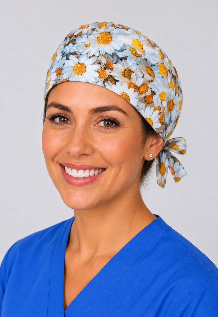 Nurse wearing daisy floral tie back scrub cap, white and yellow flower surgical cap with side tie by OR World