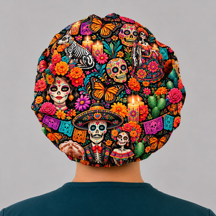 Back view of a Day of the Dead bouffant scrub cap showing the adjustable elastic back and a Xolo dog, pan de muerto and ofrenda candles in the OR World original print