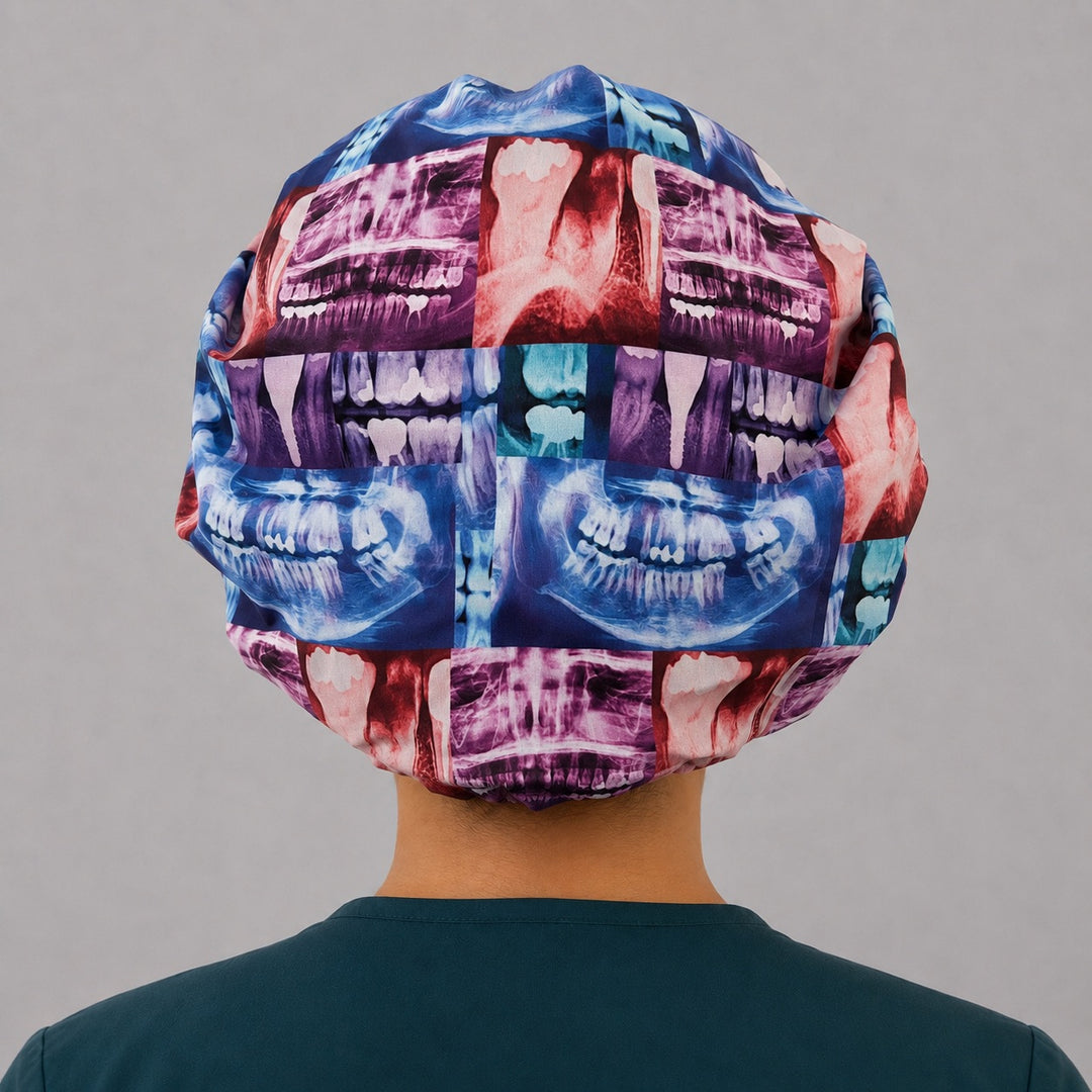 Back view of the dental X-ray bouffant scrub cap showing the full roomy fit and elastic gather — colorful teeth radiograph print for dentists and hygienists