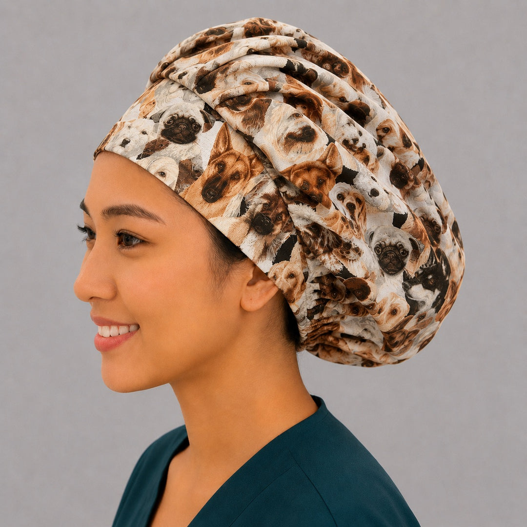 Dog lovers bouffant scrub cap left three-quarter angle on smiling model showing realistic dog breeds print, women&