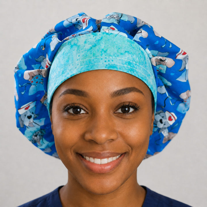 Woman wearing a dog nurse bouffant scrub cap, front view — puppies in scrubs on royal blue with aqua-green band, adjustable women&