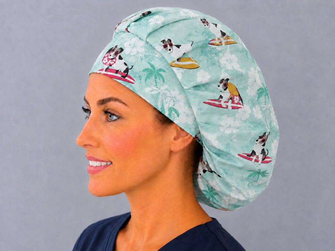 Back view of the dog surfers bouffant scrub cap — surfing dogs, surfboards and palms across the full mint aqua crown